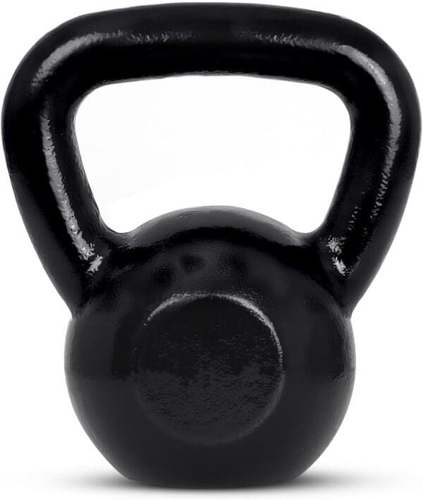 A black kettlebell is sitting on top of the floor.