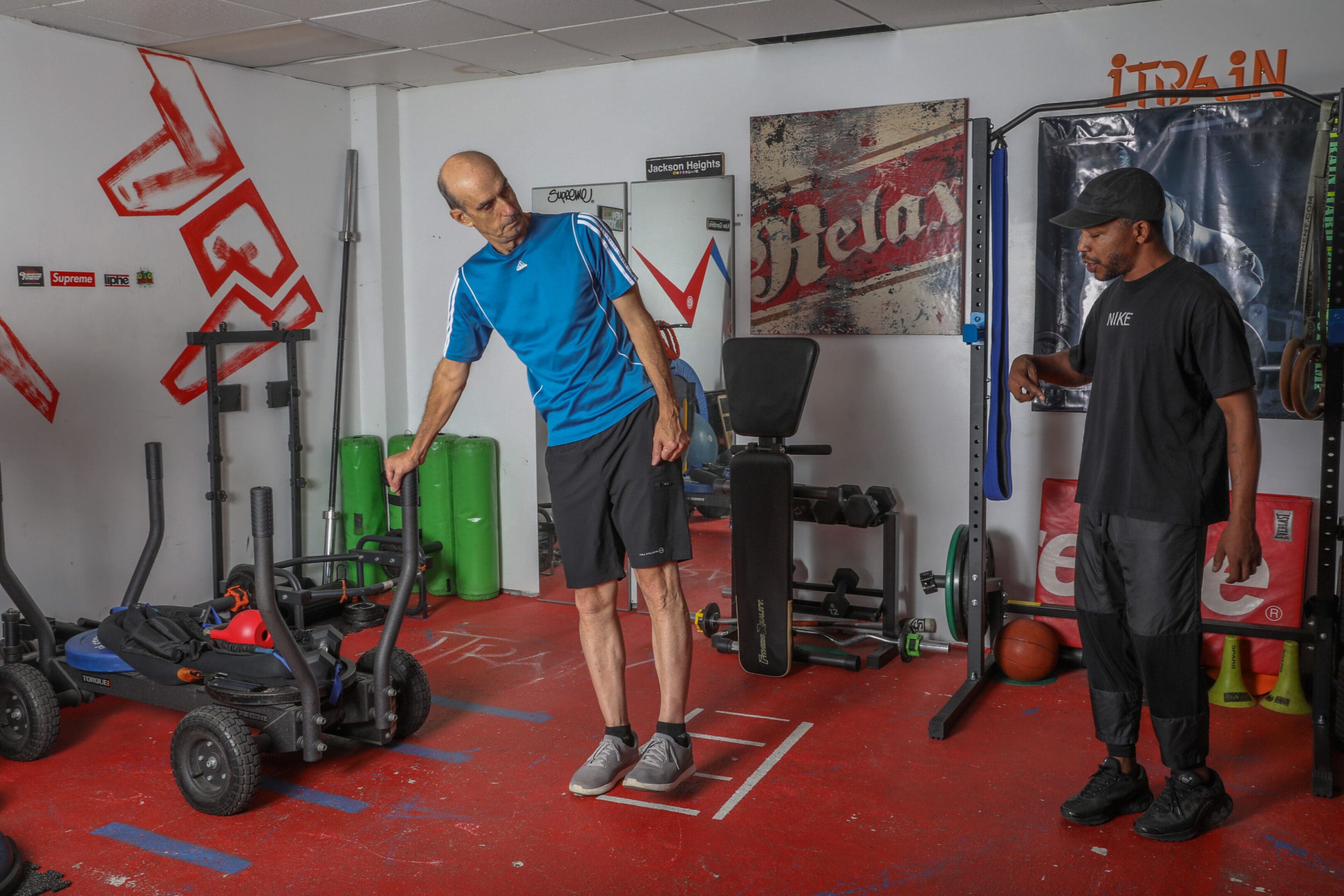 A man standing on a platform in the gym