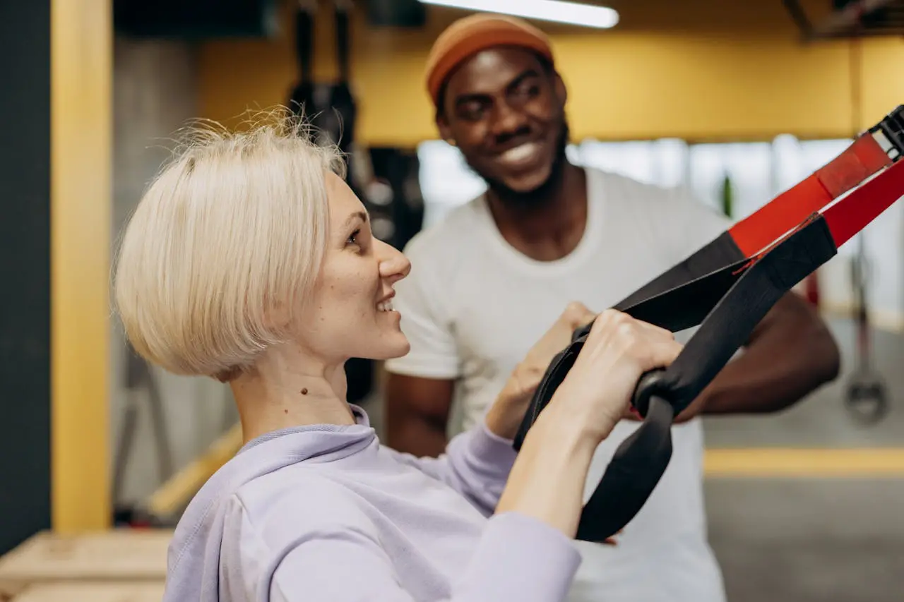 A woman is holding onto a weight bar